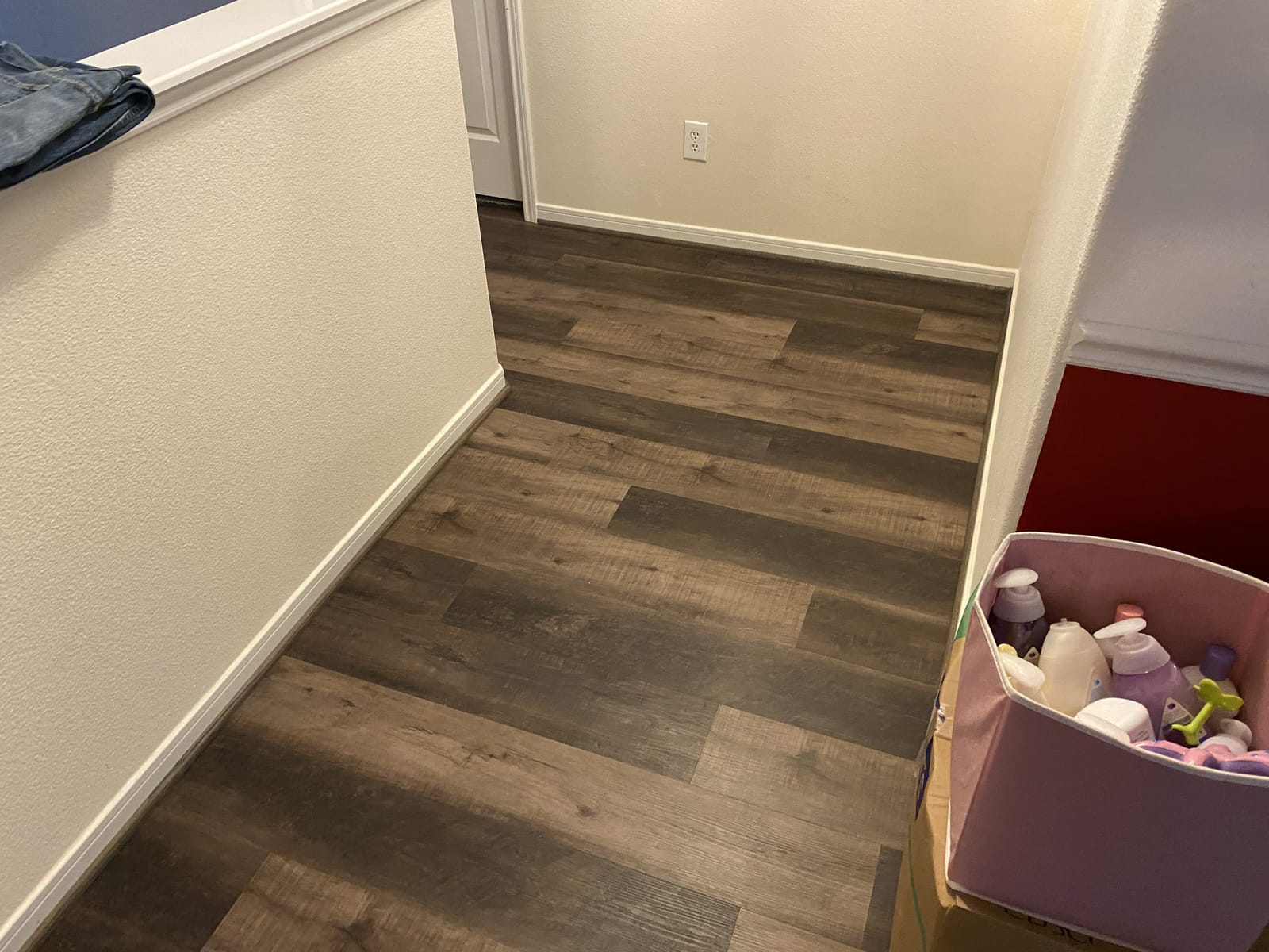 Continuous vinyl plank from hallway into the living area