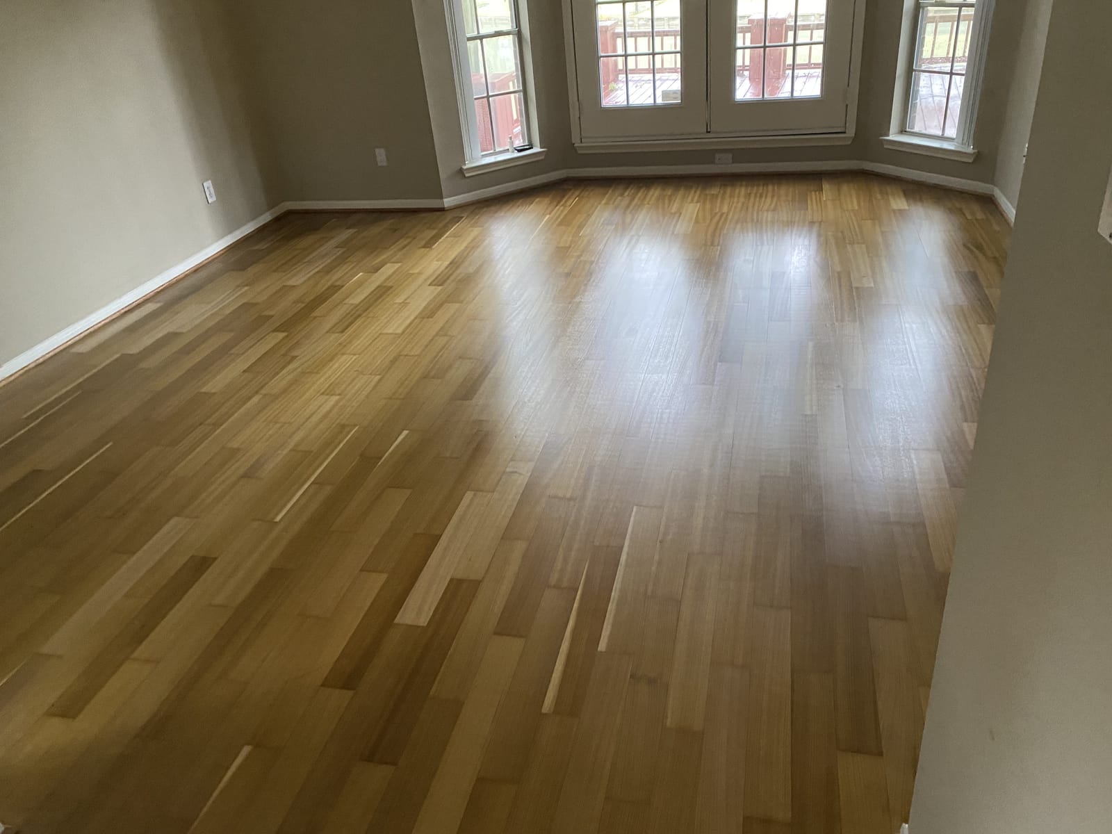 Sanded and refinished oak in a bay-window room