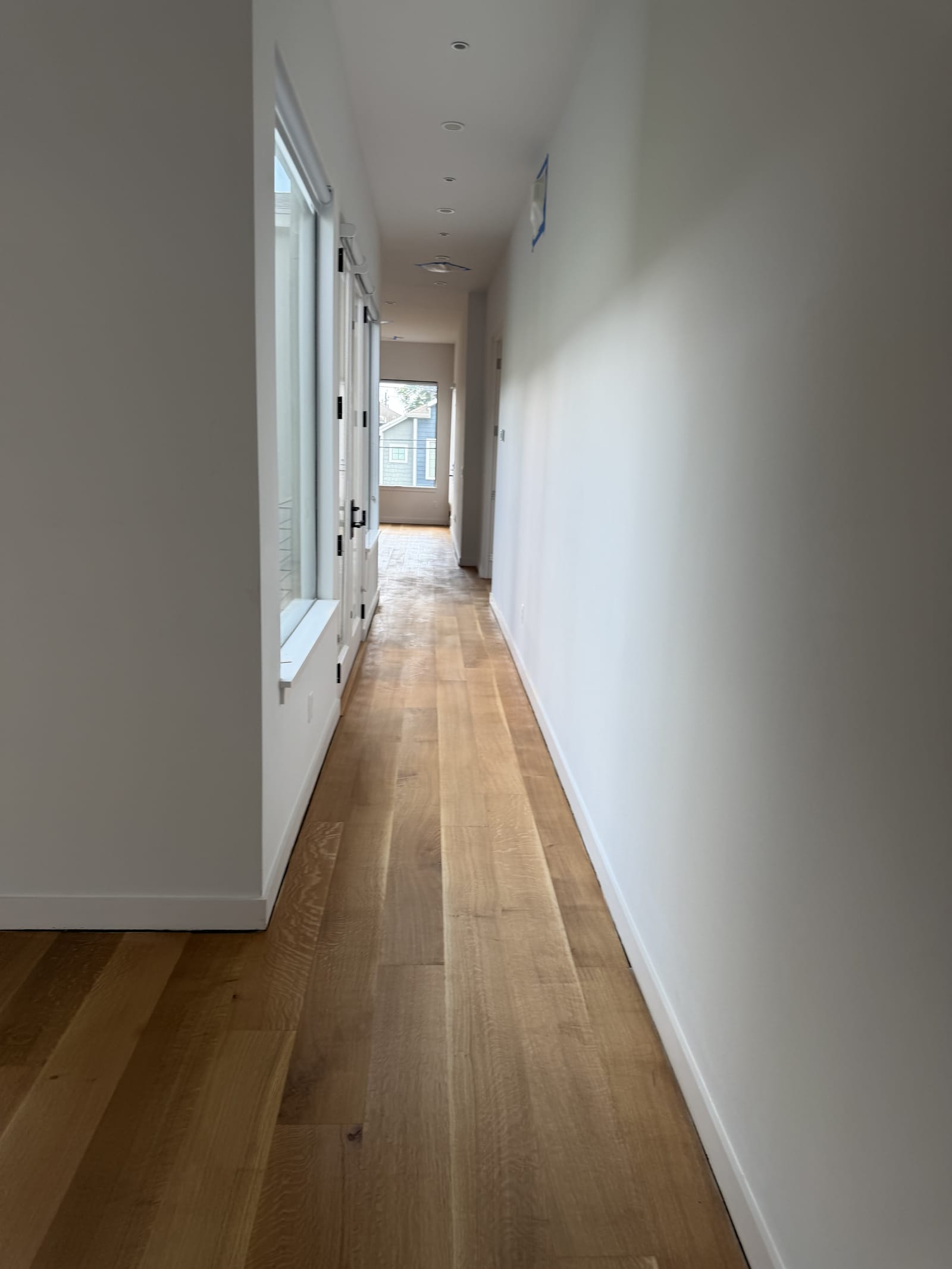 Wide-plank hallway with a clean sightline