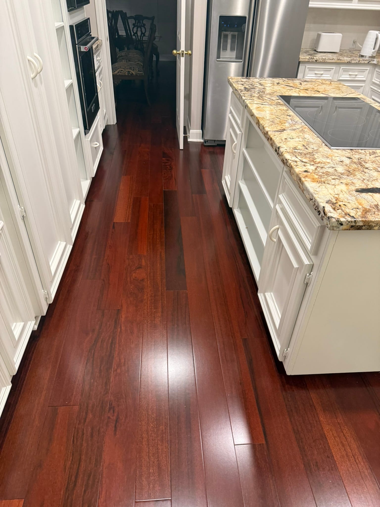 Brazilian cherry hardwood in a granite-island kitchen